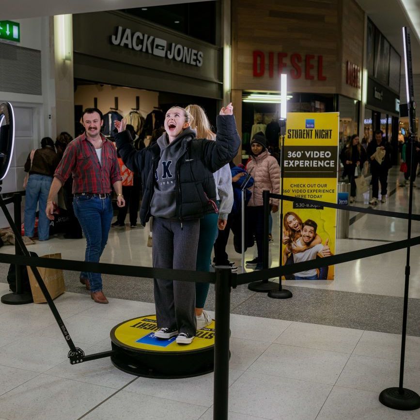 360 video booth brand activation at a shopping centre with stanchion queue and event signage