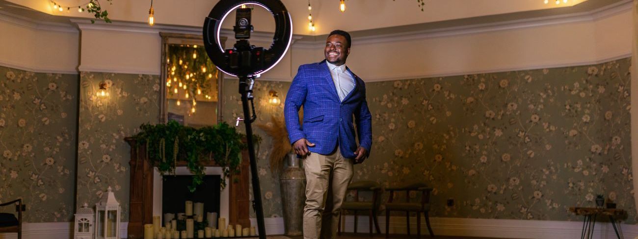 A 360 video booth set up at a luxury venue with Edison lights