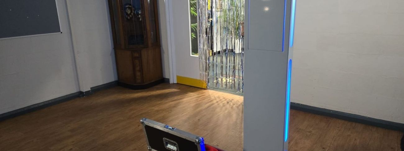 A selfie pod photo booth at an event at Esher Rugby Club