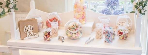 A clean, well-presented Surrey FaceBooth candy and sweet cart at an event