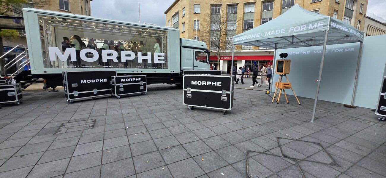 Morphe's branded touring trailer and flight cases alongside our Vintage Photo Booth under its gazebo