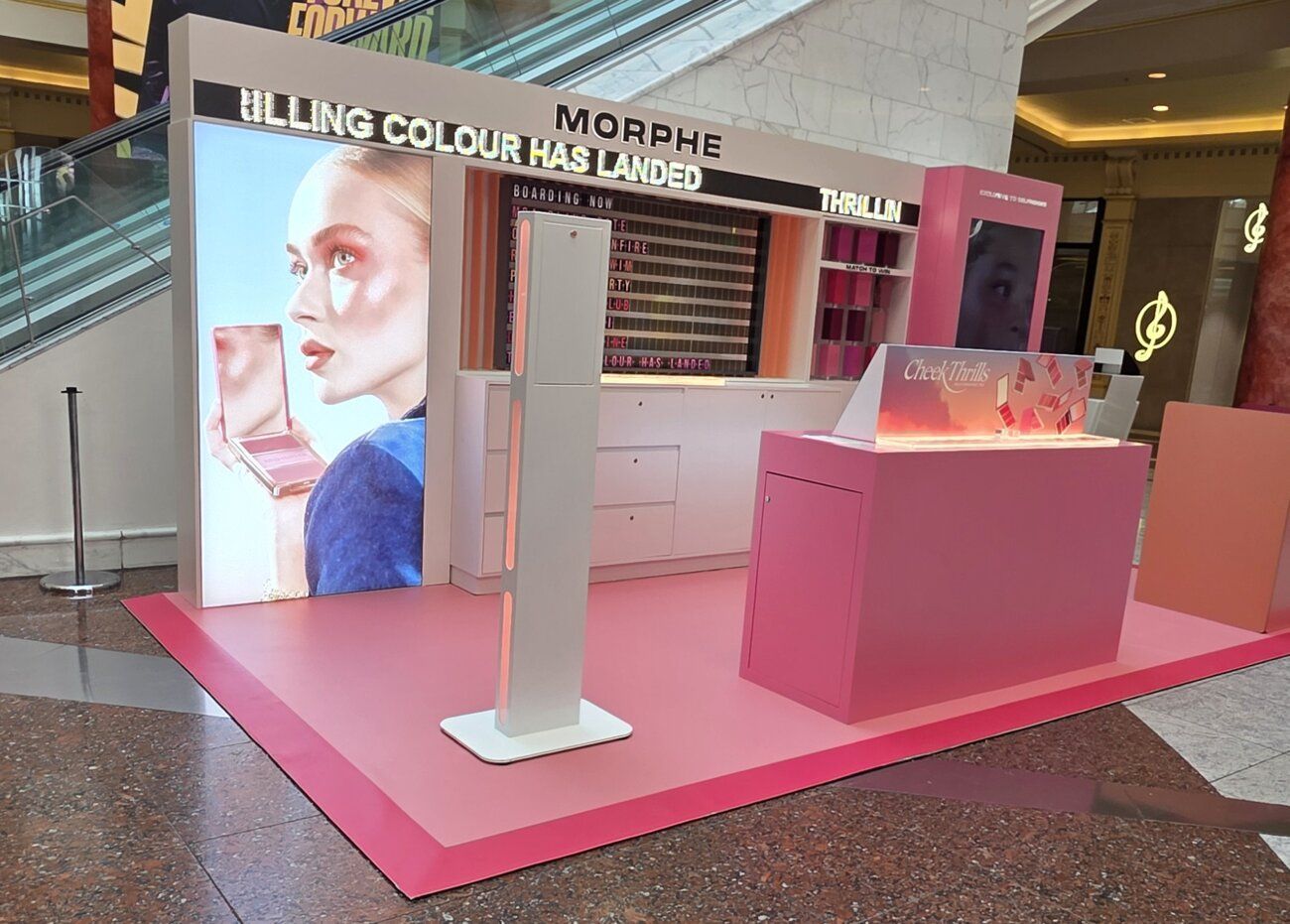 The Morphe pop-up stand in Manchester with product counters, campaign wall and our Selfie Pod