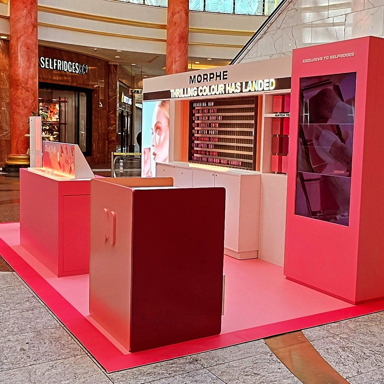 The Morphe pop-up stand in Manchester from the corner, with the Selfridges & Co entrance behind