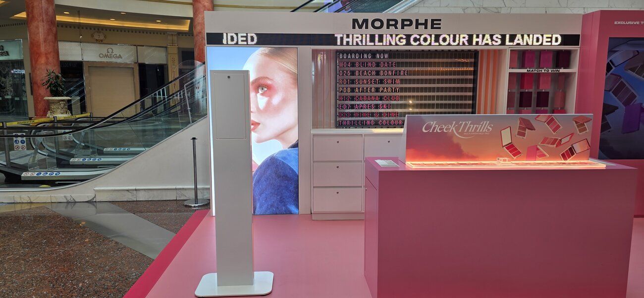 The Morphe pop-up stand with product counter, prize board and our white Selfie Pod