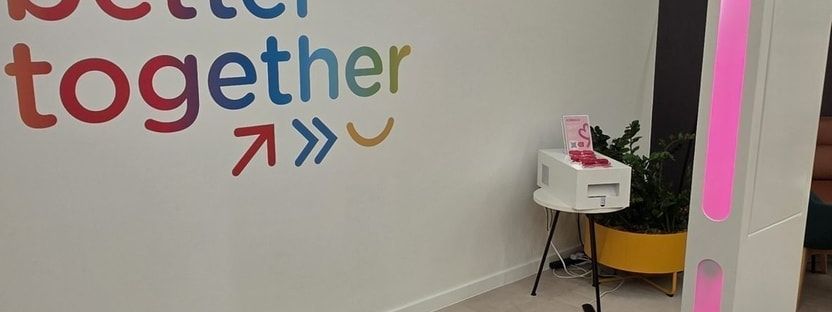 A branded selfie pod photo booth at a corporate event for TotalEnergies