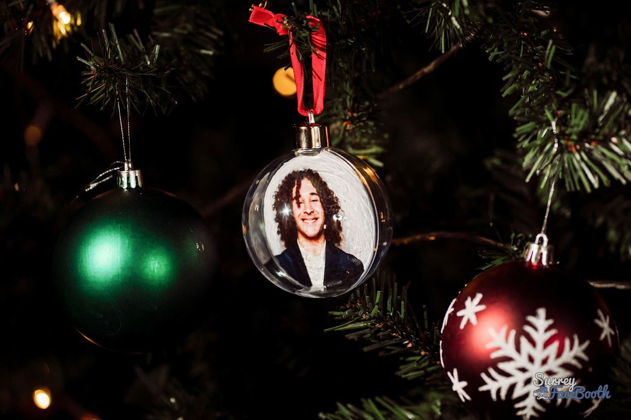 Photo Bauble Hanging Between Traditional Tree Baubles