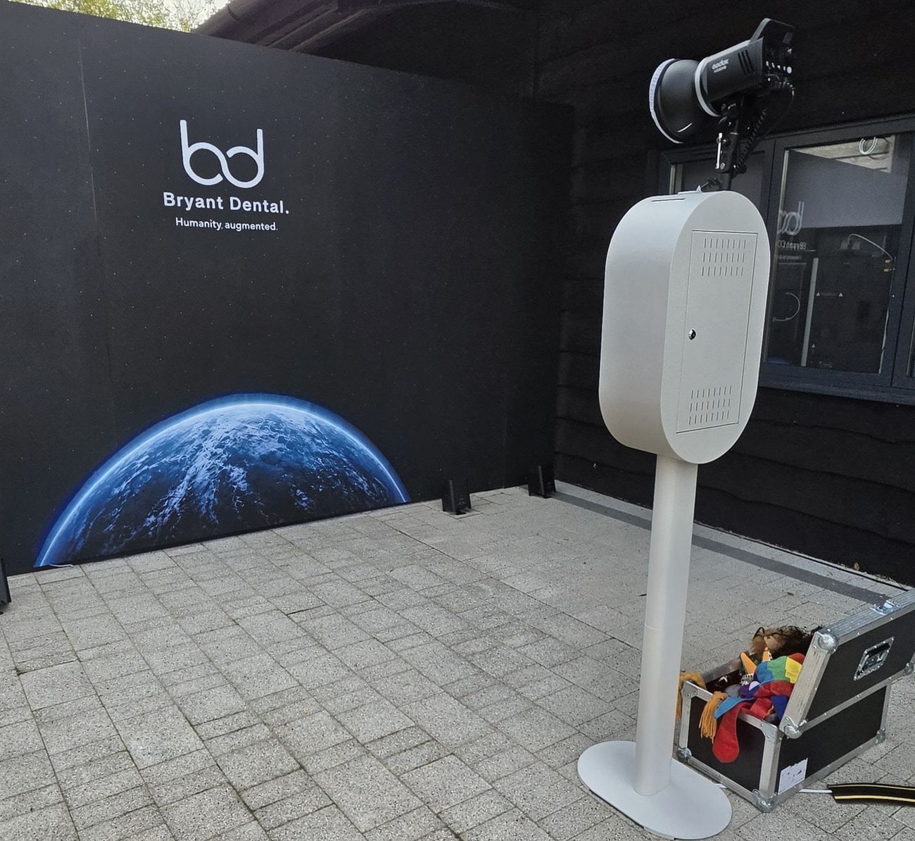 DSLR Selfie Pod set up in front of a custom Bryant Dental backdrop