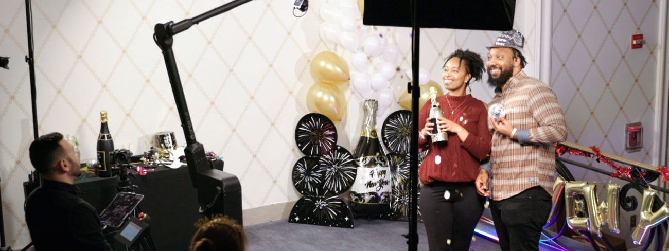 A couple with champagne at a glamorous New Year's Eve celebration