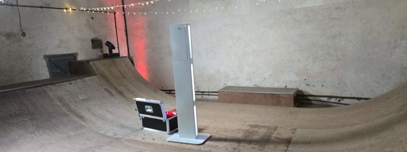A selfie pod photo booth set up at a summer party