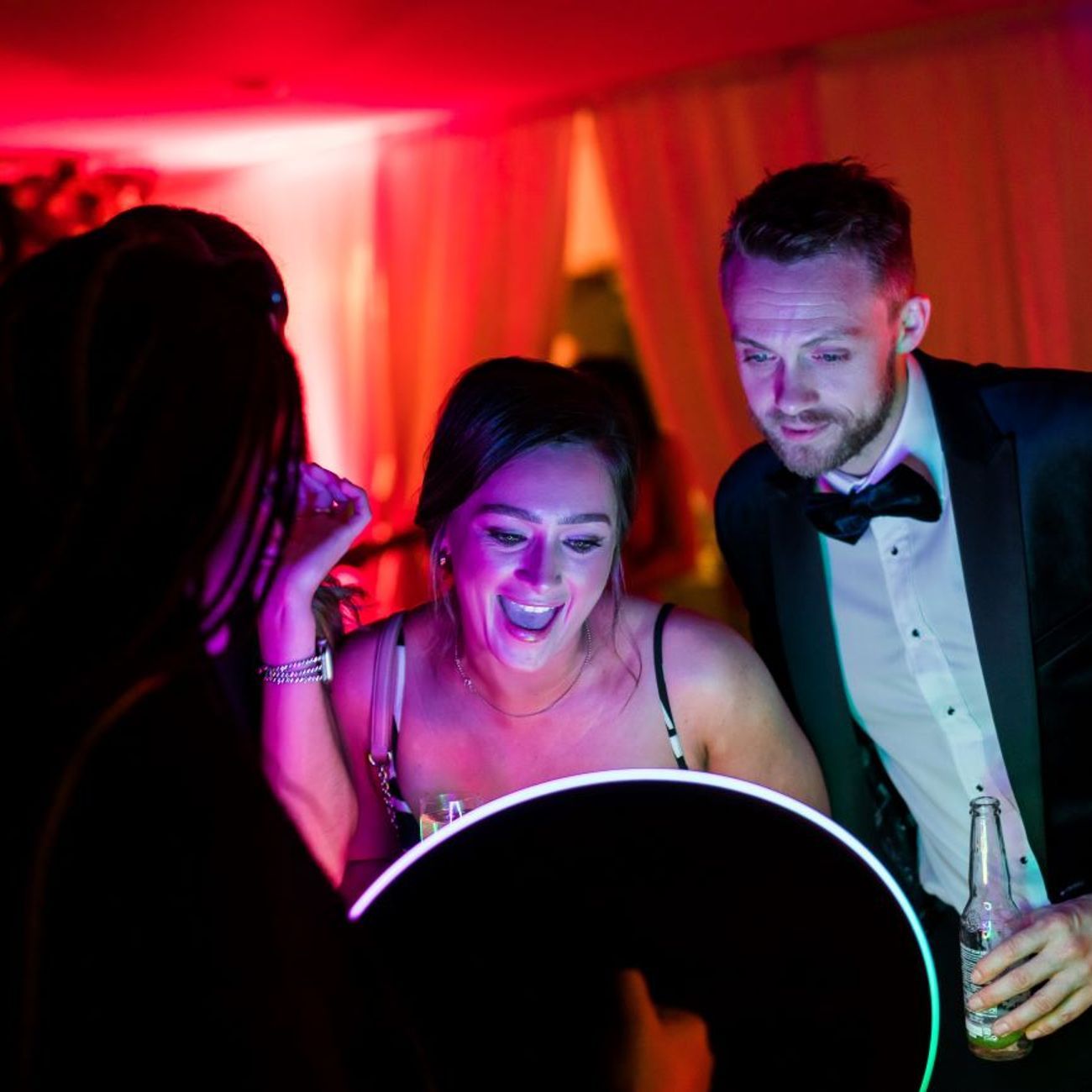 Ring Roamer Couple Laughing Marquee Red Uplighting