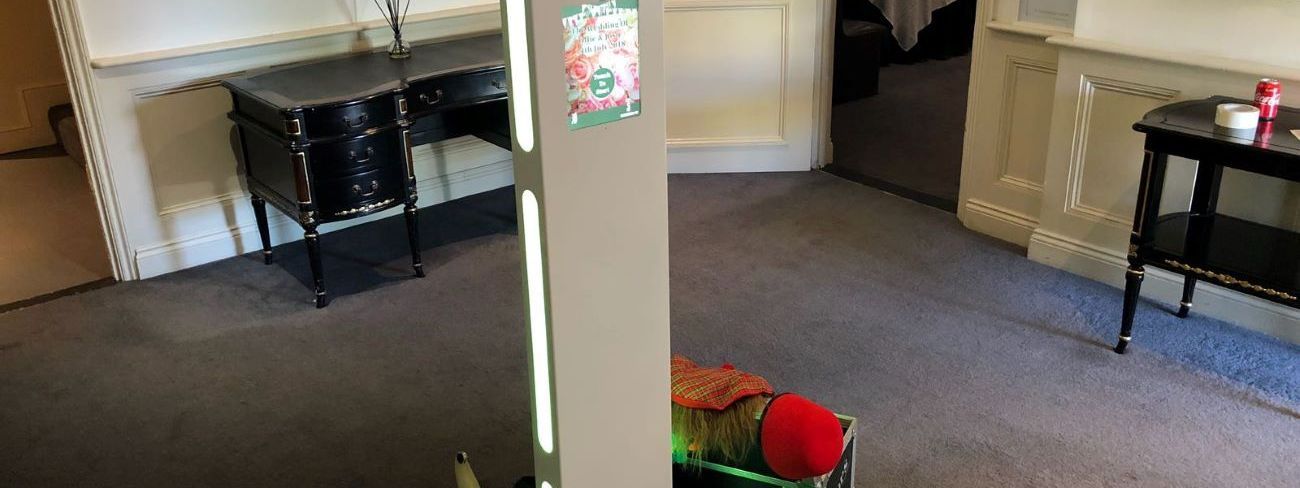 A photo booth props case set up at a wedding venue