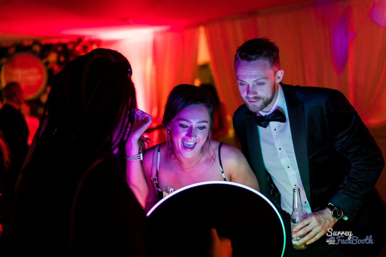 Ring Roamer Couple Laughing Marquee Red Uplighting