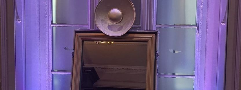Wedding guests using a magic mirror photo booth at De Vere Latimer Estate
